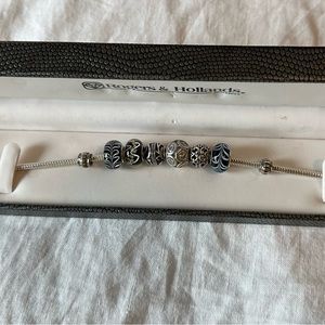 Charm Bracelet with 6 charms and 2 stoppers